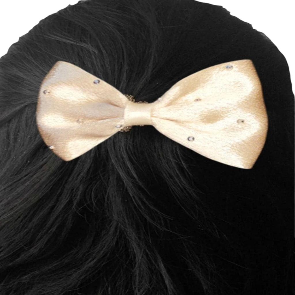 Beige bow on black hair