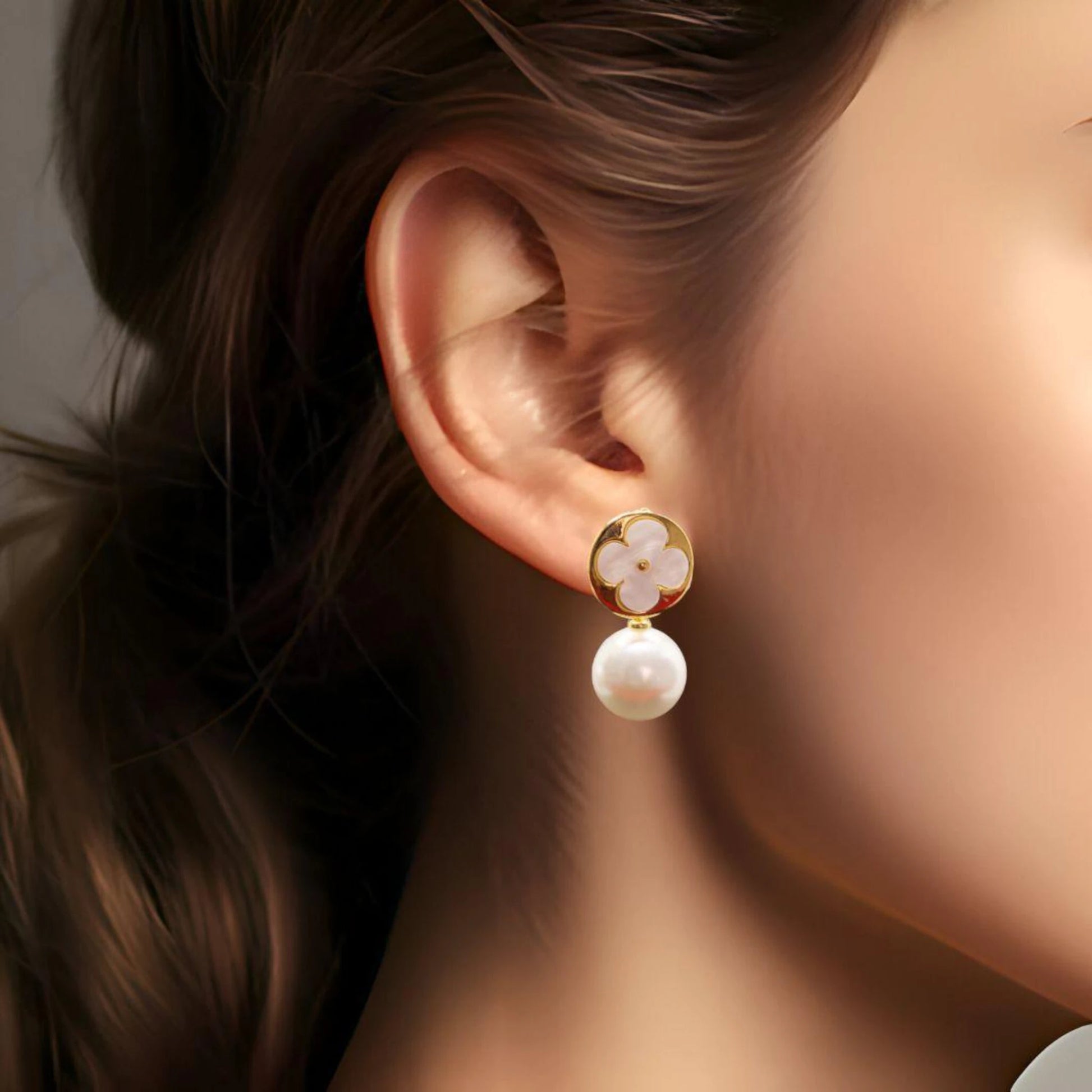 White Clover Pearl Drop Earrings worn by a model.