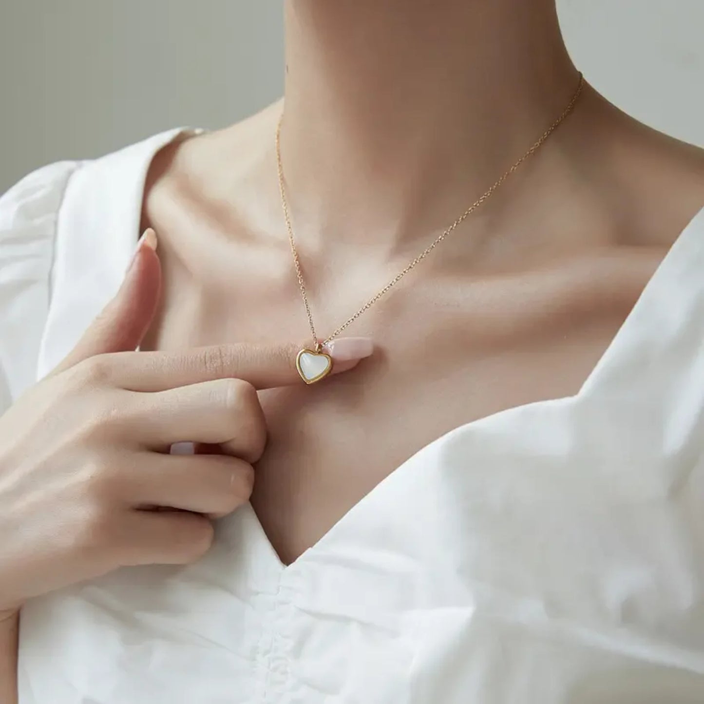 Necklace worn by a model.