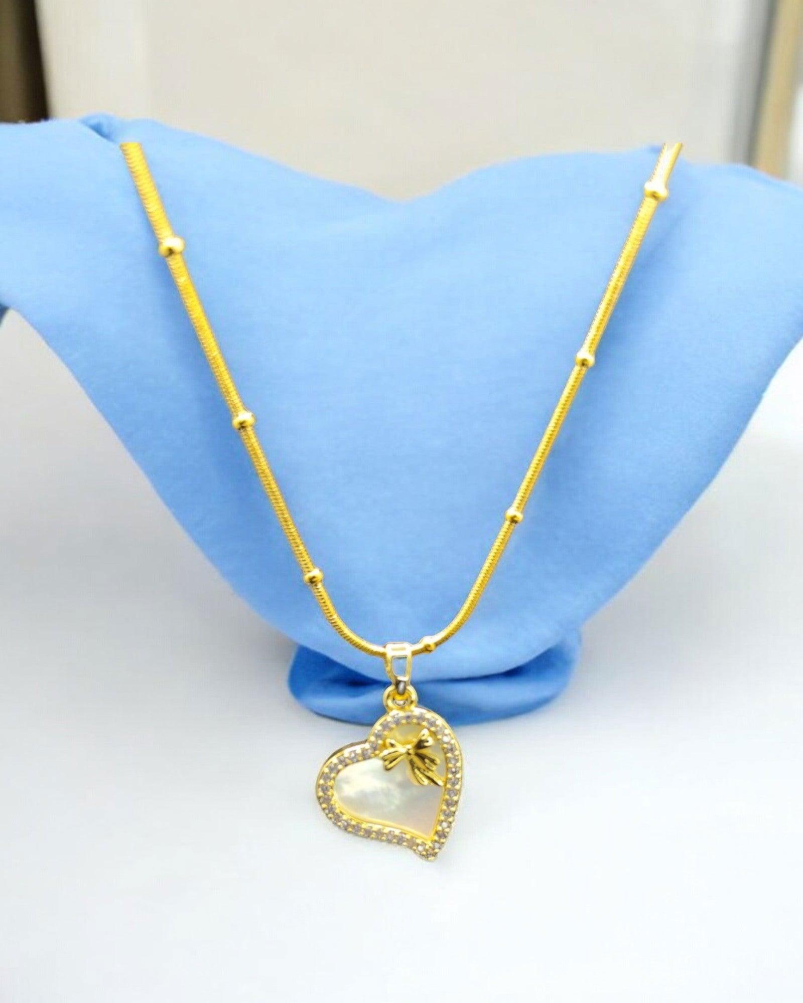 Gold Heart - Shaped Necklace with Pearl Inlay and Bow - JESPARA